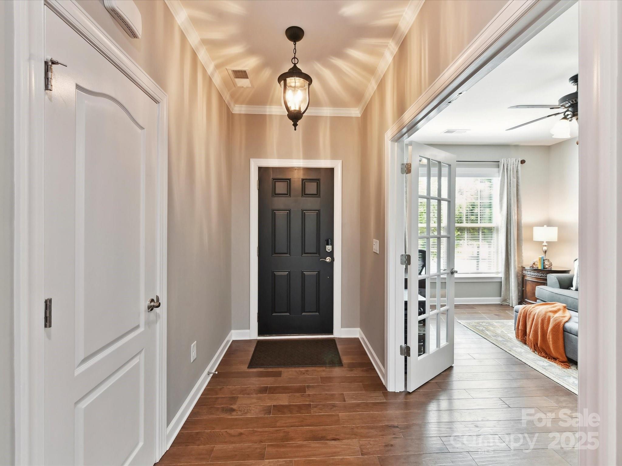 2972 Arches Bluff Circle Lancaster, SC 29720 - Photo 5 of 47 a view of a hallway with the couches and chandelier