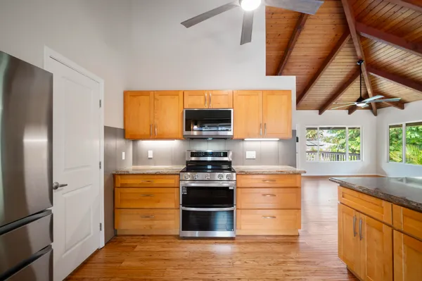 a kitchen with stainless steel appliances a stove and a refrigerator