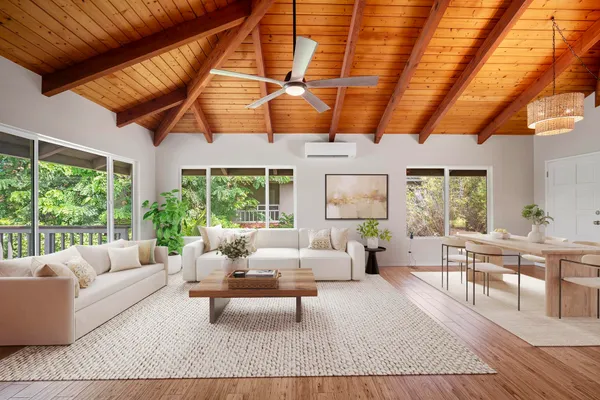 a living room with furniture and wooden floor