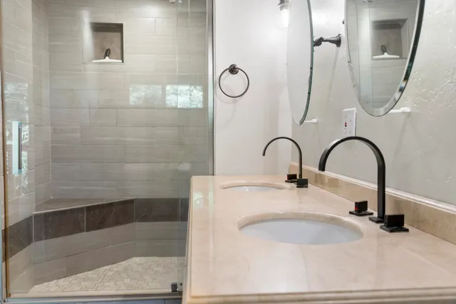 a bathroom with a sink and a mirror