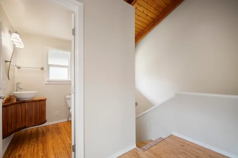 a view of balcony with wooden floor