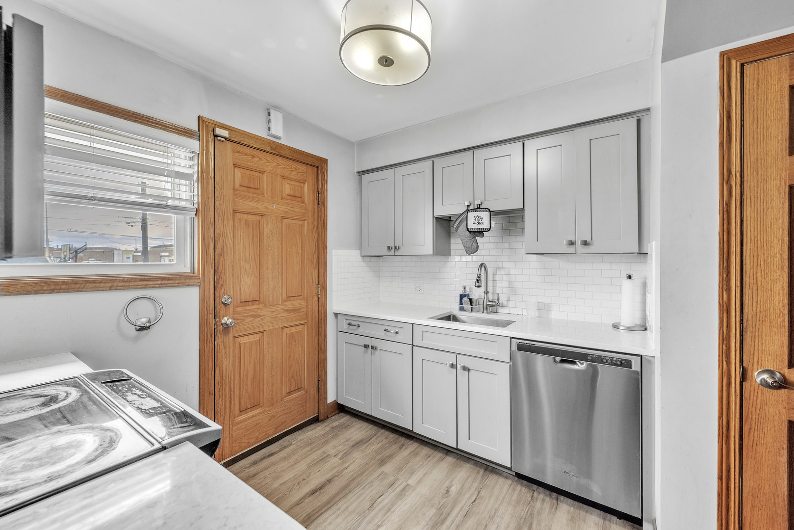 5249 West 64th Place Chicago, IL 60638 - Photo 8 of 23 a kitchen with stainless steel appliances granite countertop a sink and cabinets
