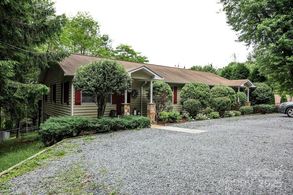 306 Margot Road Boone, NC 28607 - Photo 1 of 6 a front view of a house with a yard