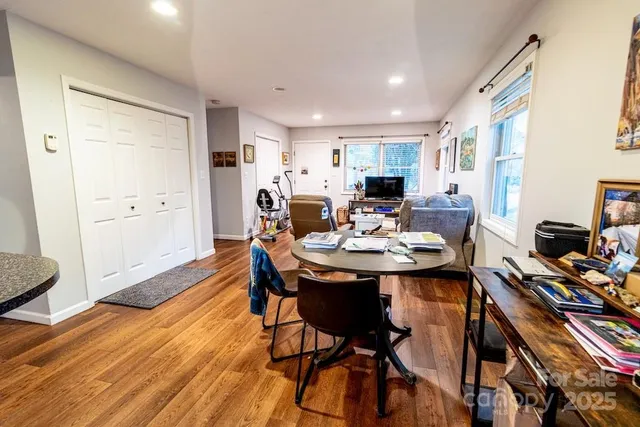 a view of a dining room with furniture and wooden floor