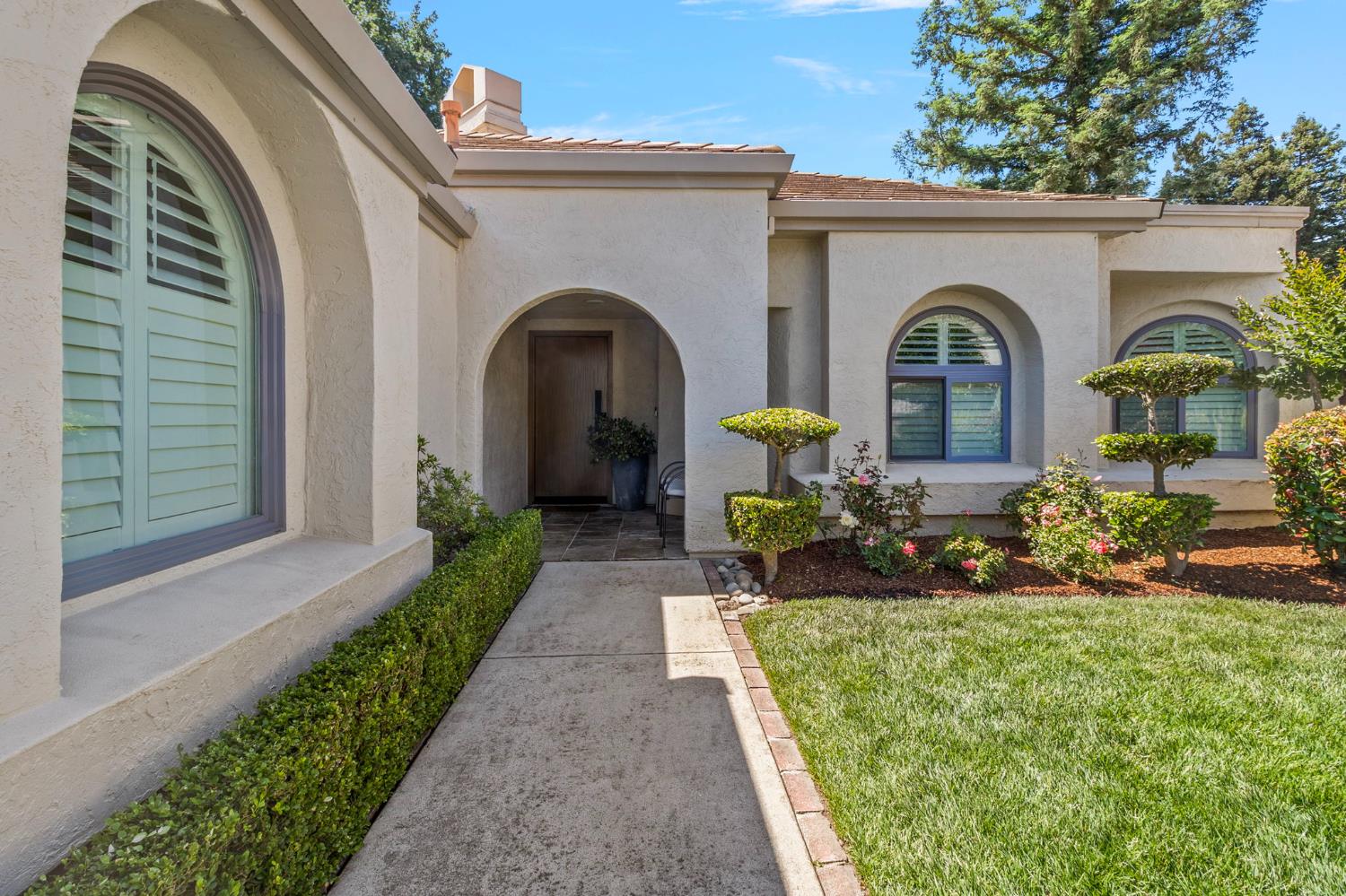 1013 Copper Lake Court Modesto, CA 95355 - Photo 41 of 66 a front view of a house with garden