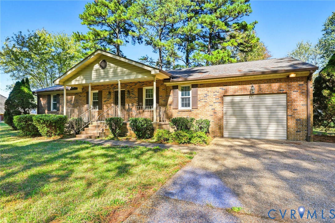 2521 Fort Lee Road Petersburg, VA 23805 - Photo 4 of 27 a front view of a house with a yard and porch