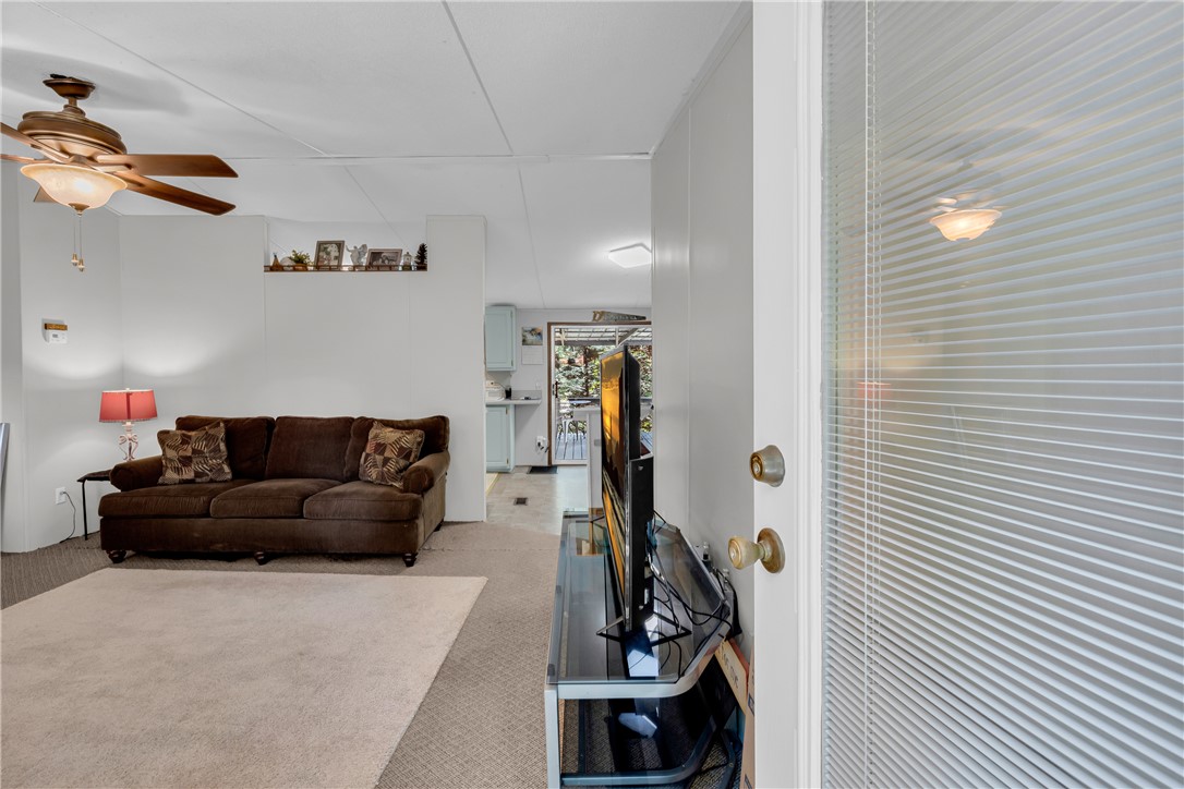 162 Newberry Road Walhalla, SC 29691 - Photo 3 of 50 Step inside this inviting living area featuring a ceiling fan and a view towards the kitchen.