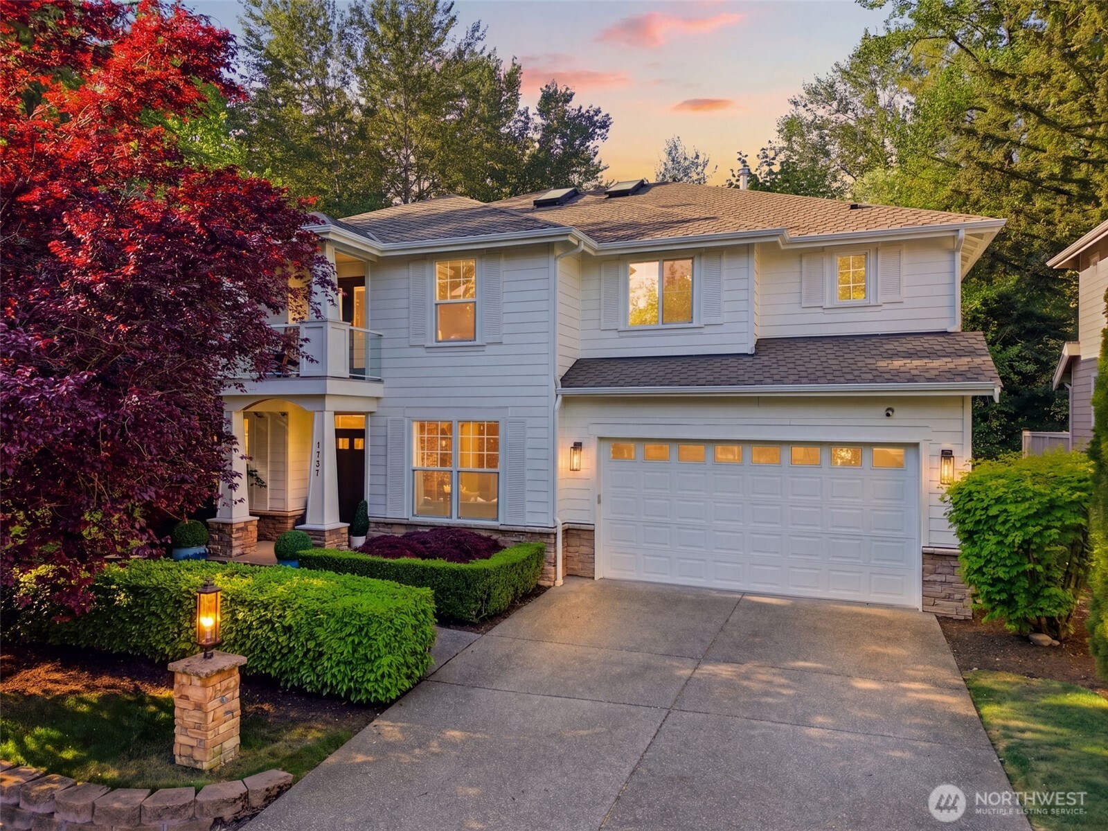 1737 Mt Baker Avenue Northeast Renton, WA 98059 - Photo 1 of 40 a front view of a house with a garden and plants