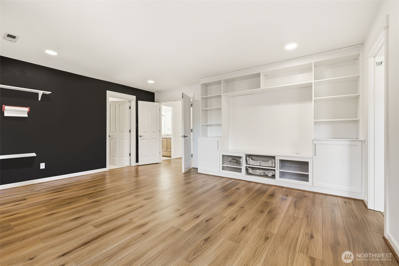 1737 Mt Baker Avenue Northeast Renton, WA 98059 - Photo 26 of 40 a view of an empty room with wooden floor and a window