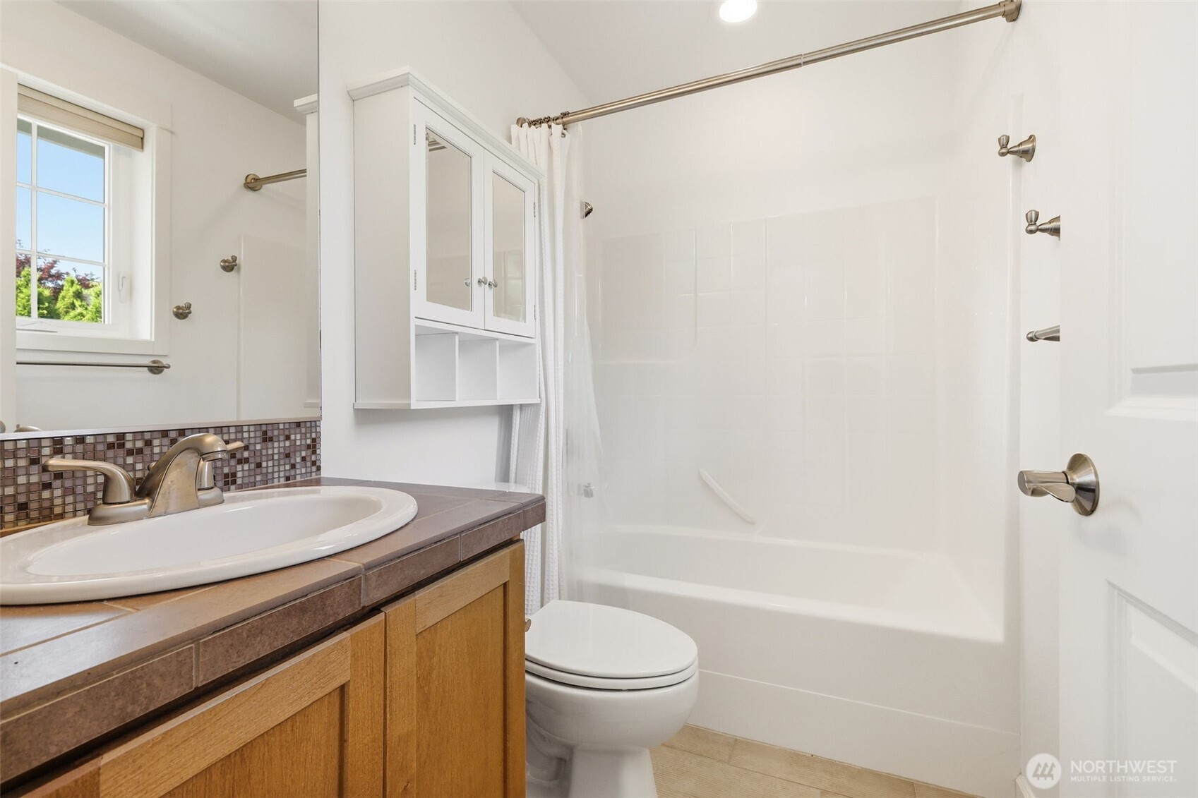 1737 Mt Baker Avenue Northeast Renton, WA 98059 - Photo 27 of 40 a bathroom with a sink a toilet and a bathtub
