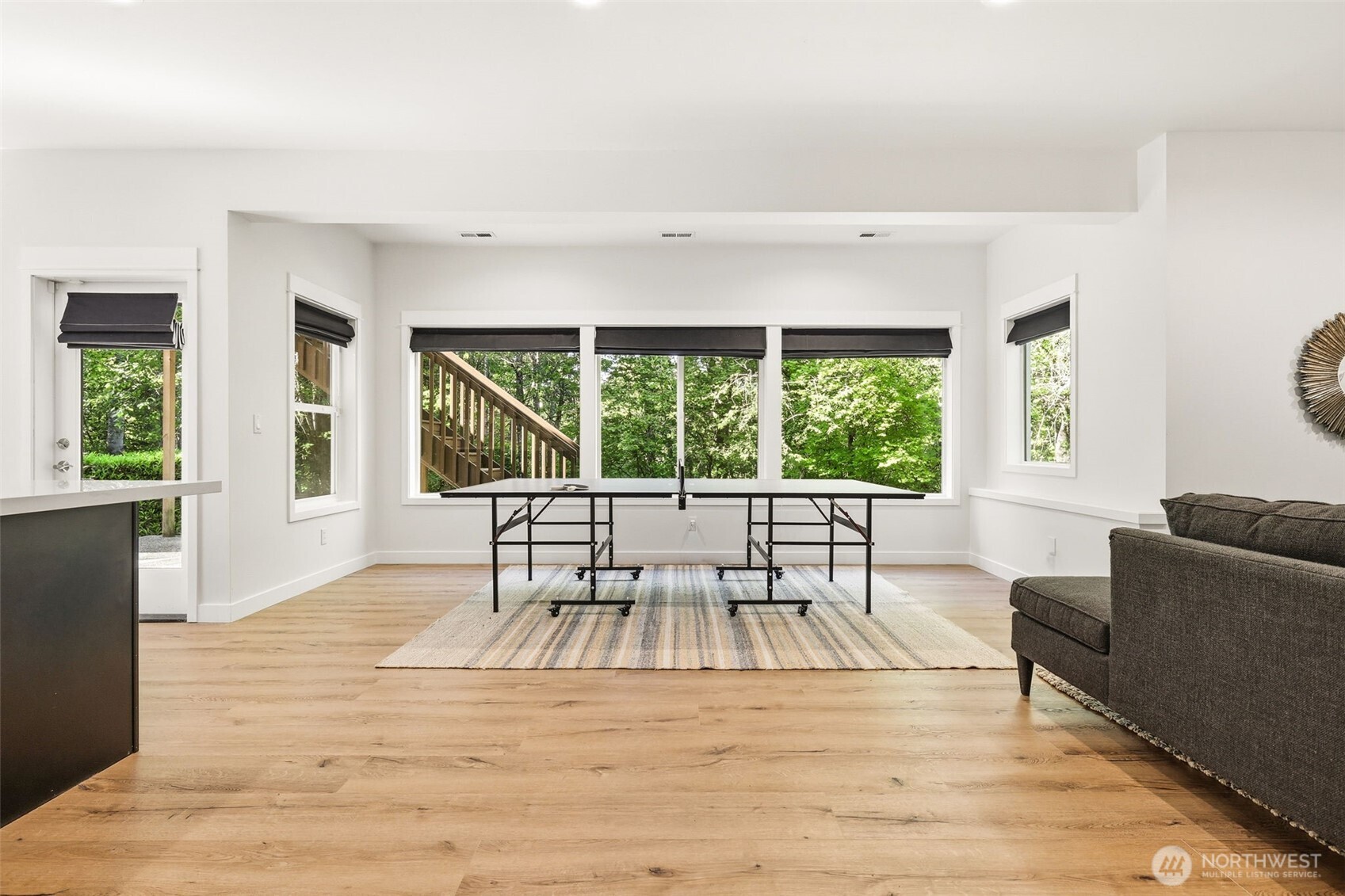1737 Mt Baker Avenue Northeast Renton, WA 98059 - Photo 32 of 40 a living room with furniture and a large window