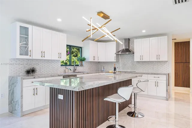 a kitchen with a sink cabinets and window