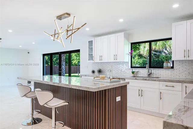 a view of a garden with large trees