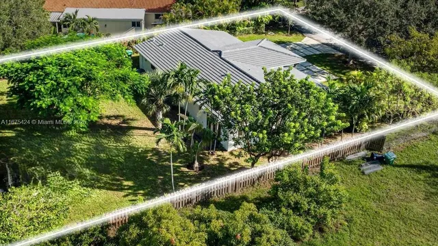 an aerial view of a house with a garden