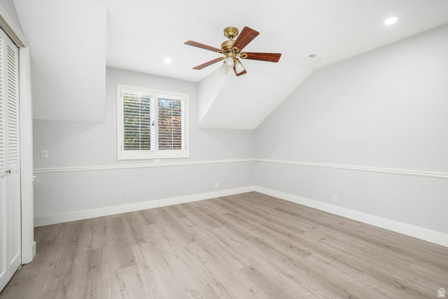 8965 Quail Run Drive Sandy, UT 84093 - Photo 22 of 56 Additional living space with a ceiling fan, light wood-style floors, vaulted ceiling, and recessed lighting