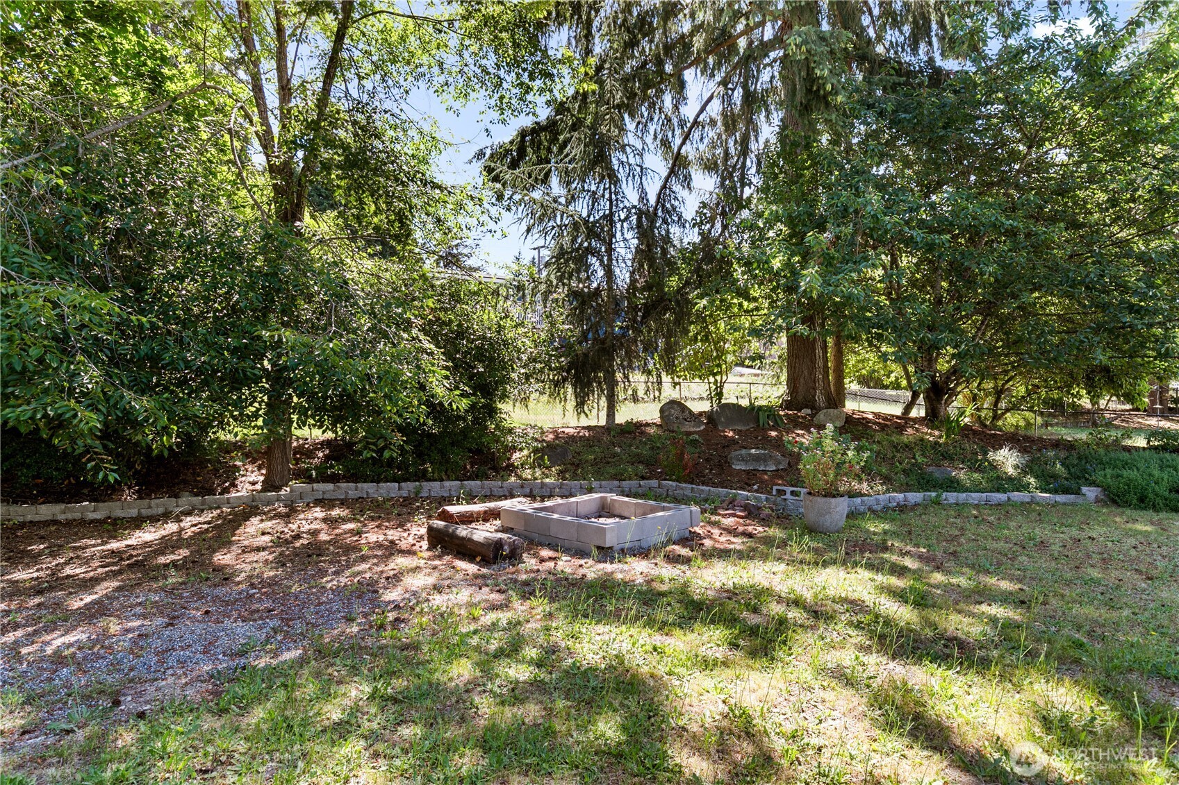 9880 Fredrickson Road Northwest Bremerton, WA 98311 - Photo 27 of 28 a backyard of a house with yard and trampoline