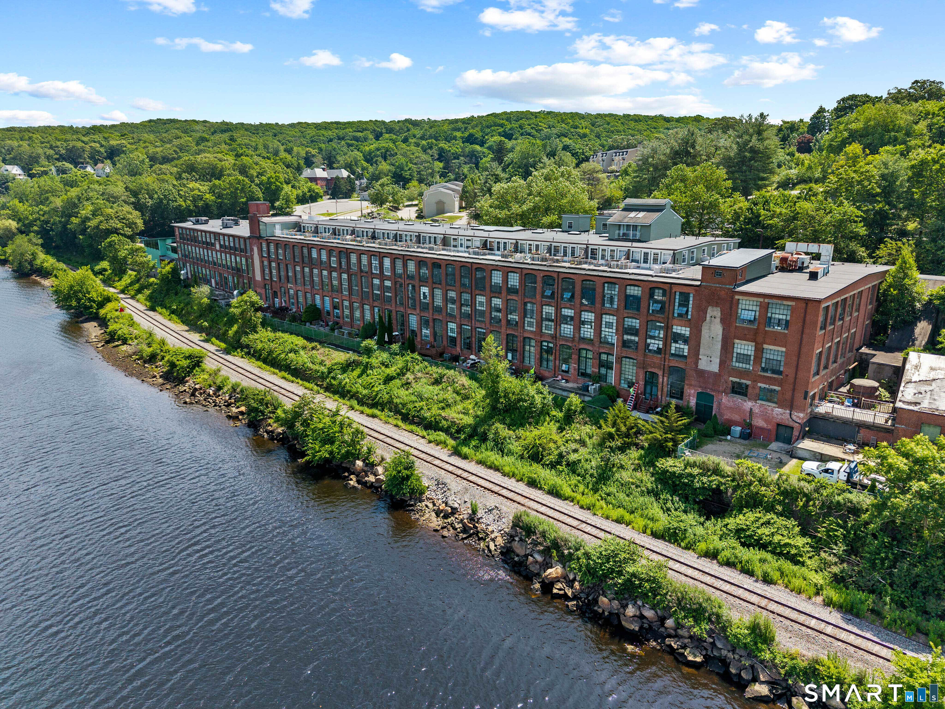a view of a street with a garden
