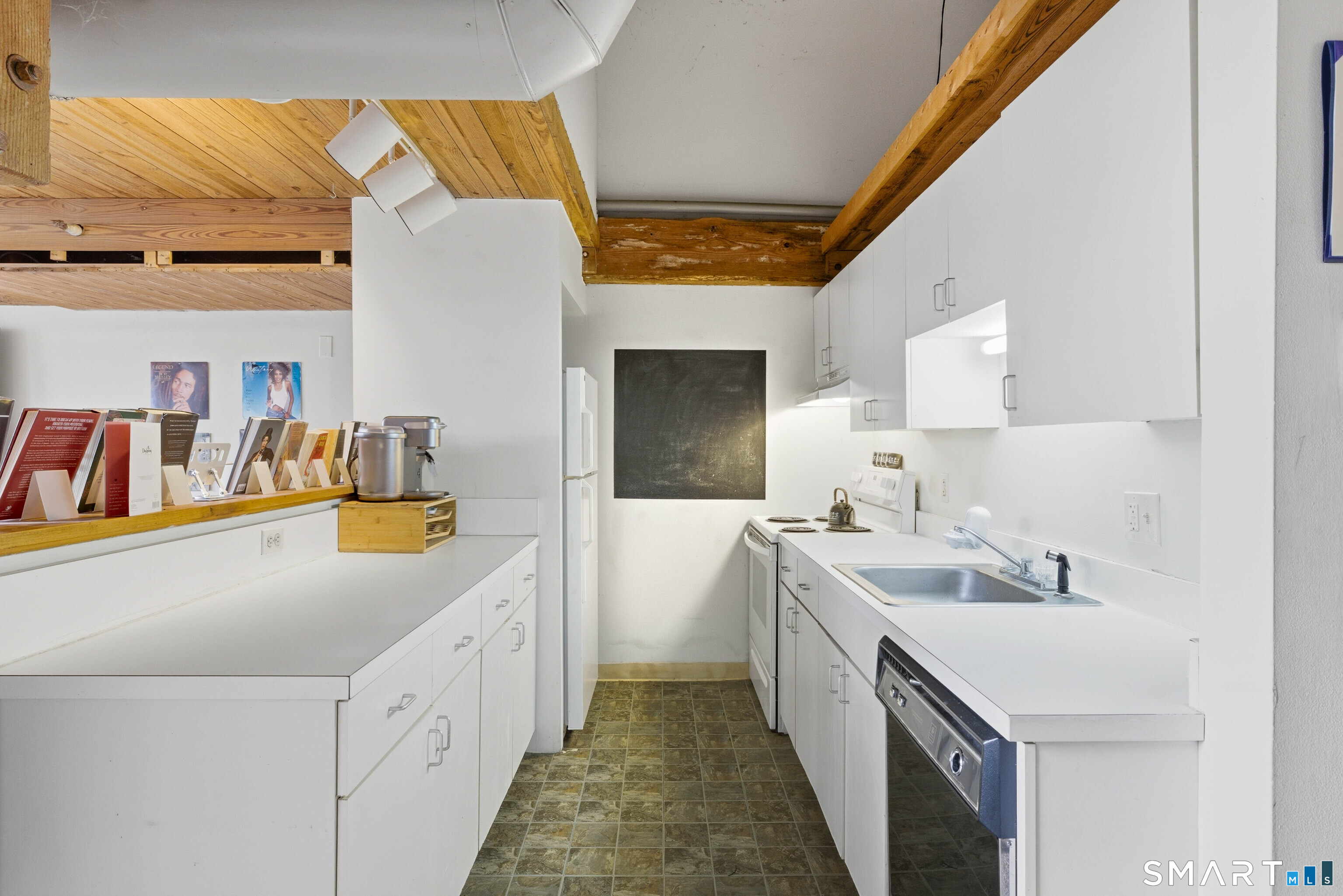 68 Thermos Avenue, Unit 110A Norwich, CT 06360 - Photo 11 of 39 a kitchen with a sink and a refrigerator