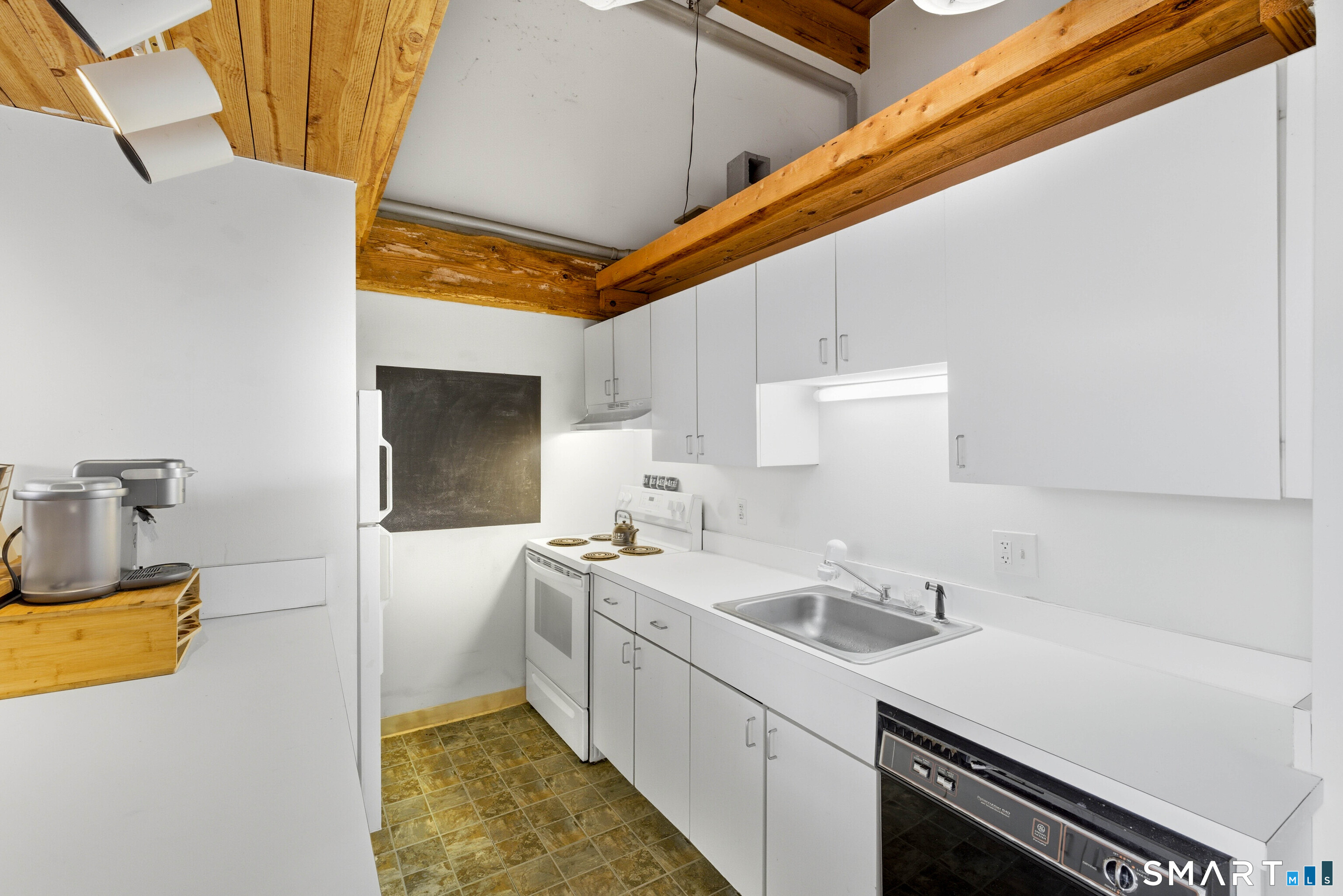 68 Thermos Avenue, Unit 110A Norwich, CT 06360 - Photo 13 of 39 a kitchen with a sink and a refrigerator