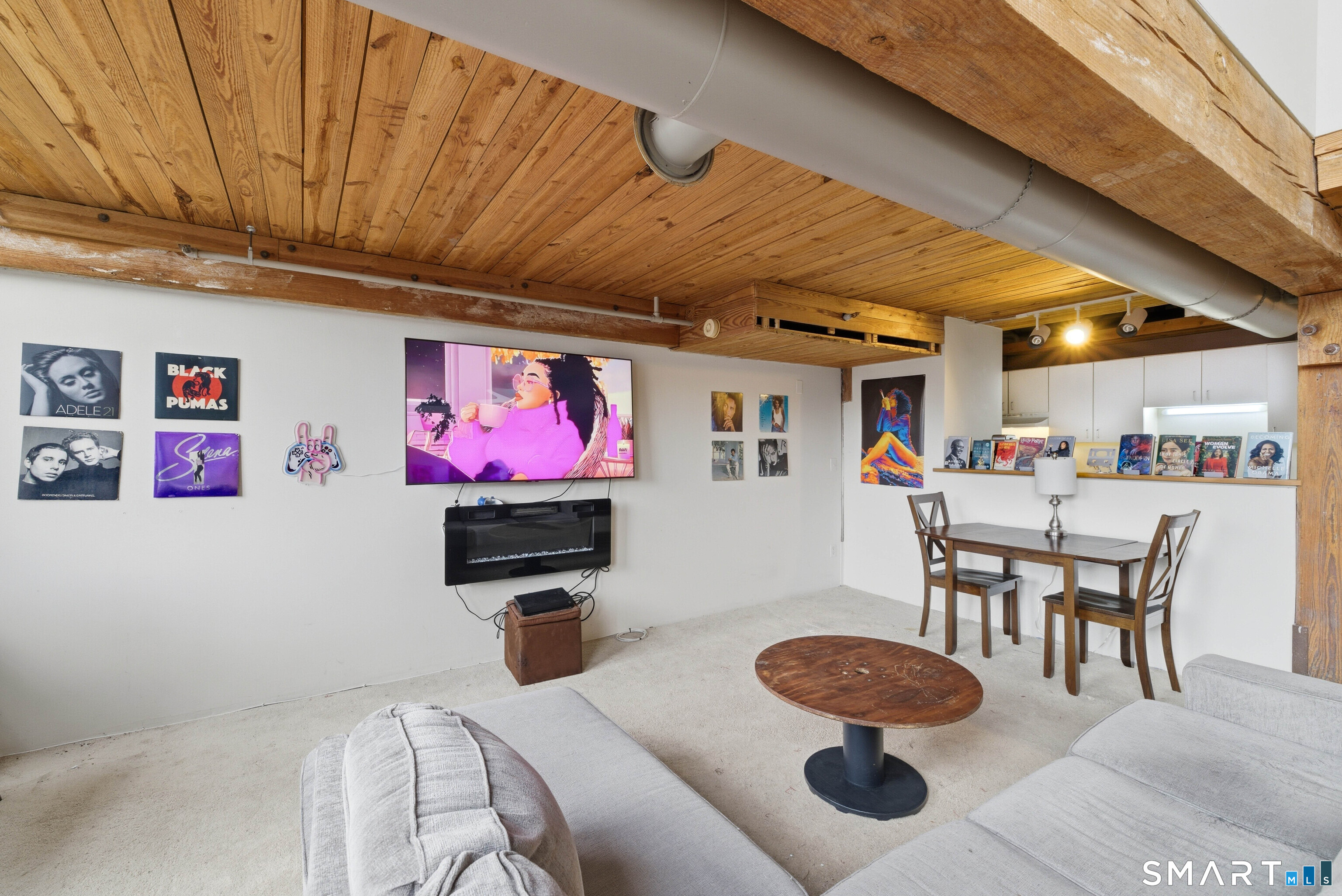 68 Thermos Avenue, Unit 110A Norwich, CT 06360 - Photo 19 of 39 a dining room with furniture and wooden floor