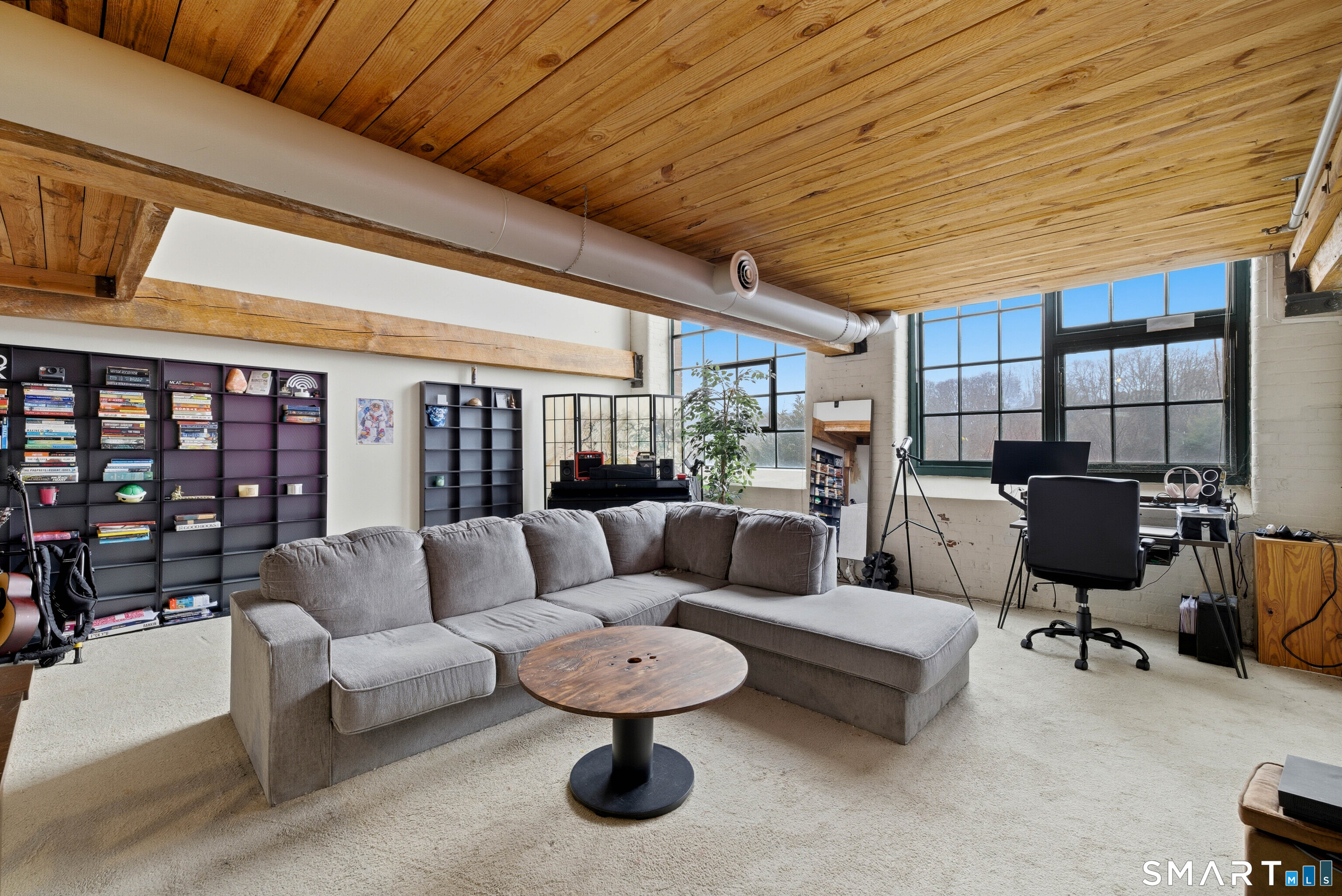 68 Thermos Avenue, Unit 110A Norwich, CT 06360 - Photo 20 of 39 a living room with furniture and a flat screen tv