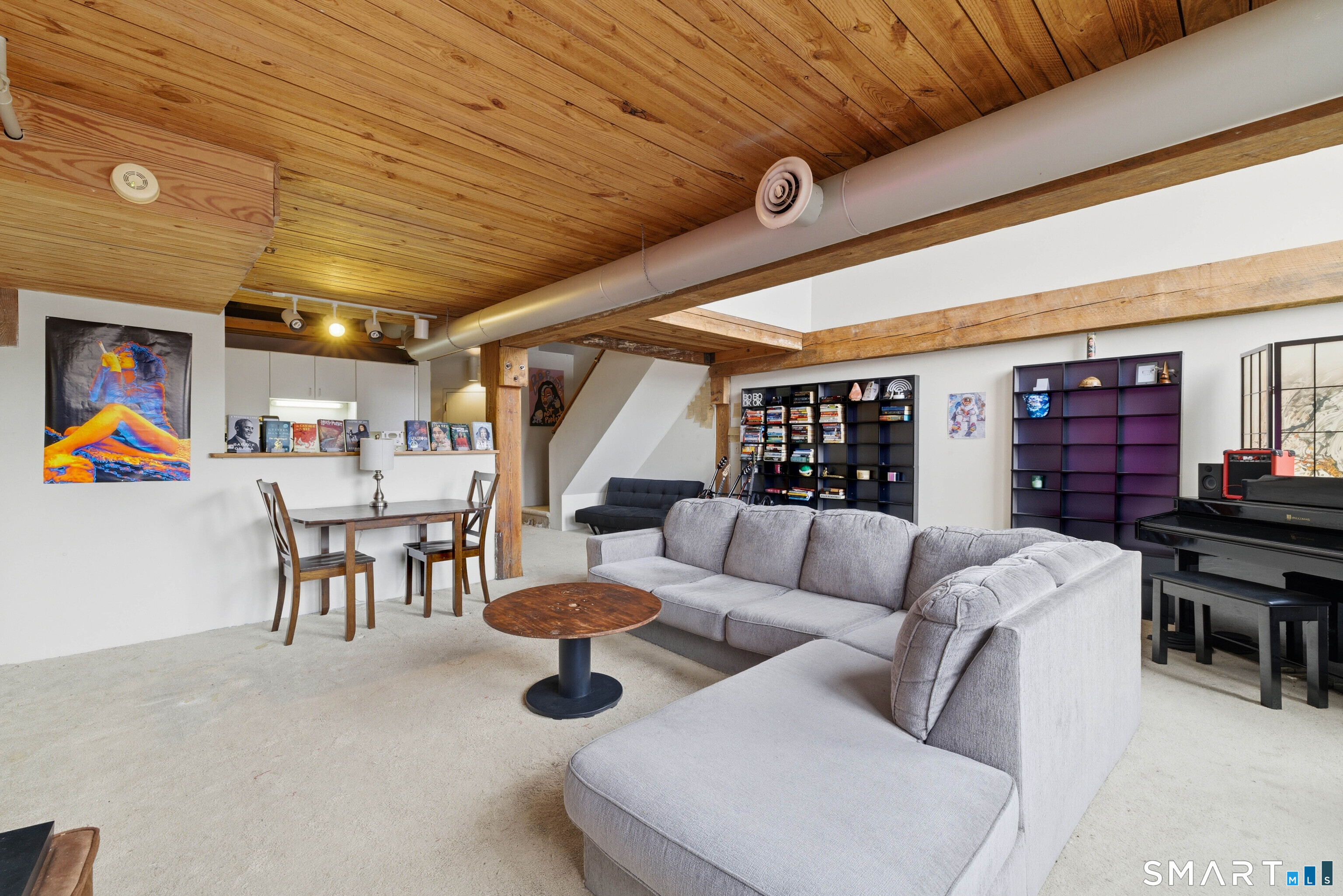 68 Thermos Avenue, Unit 110A Norwich, CT 06360 - Photo 21 of 39 a living room with furniture and a table
