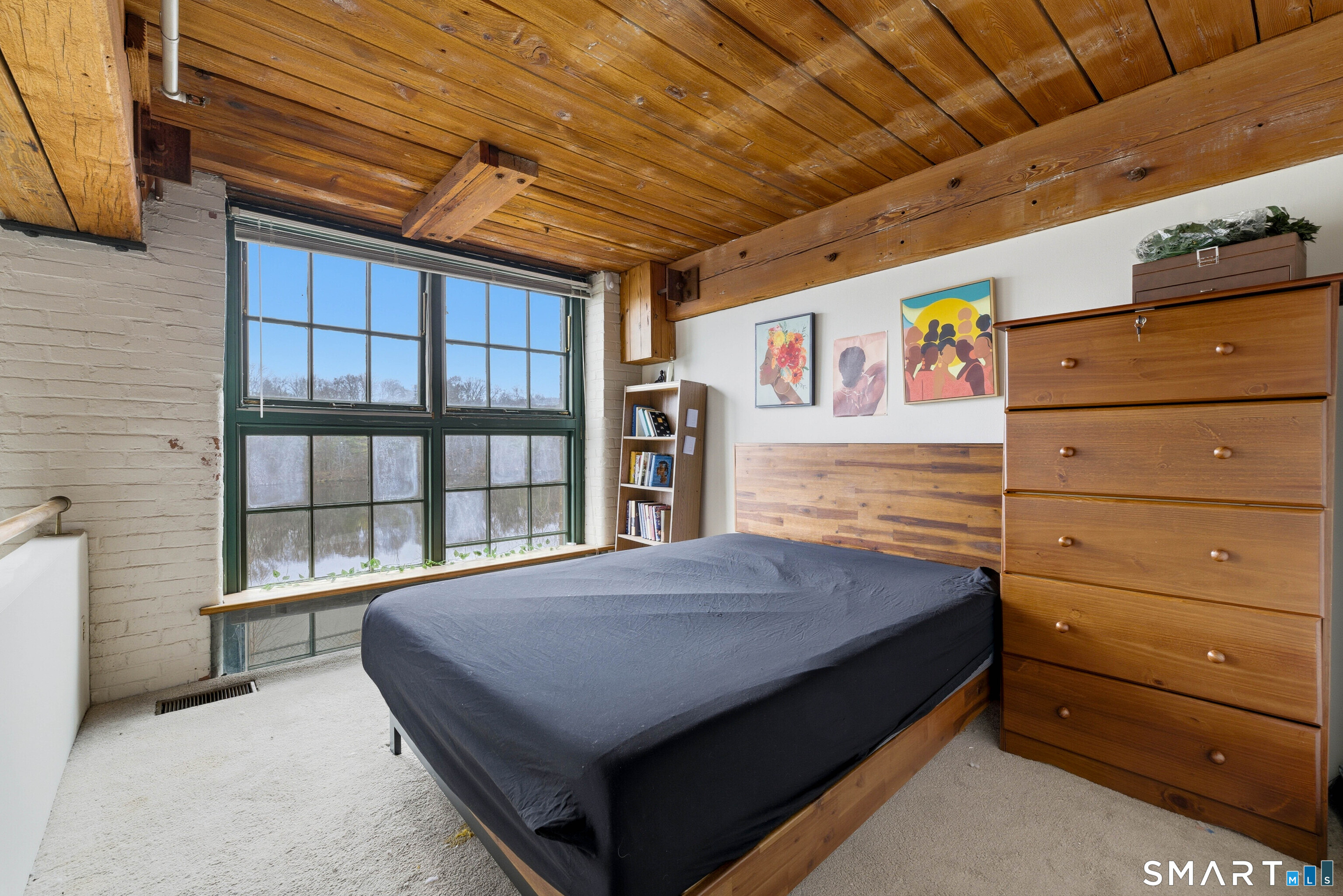 68 Thermos Avenue, Unit 110A Norwich, CT 06360 - Photo 26 of 39 a bed room with a bed and a window