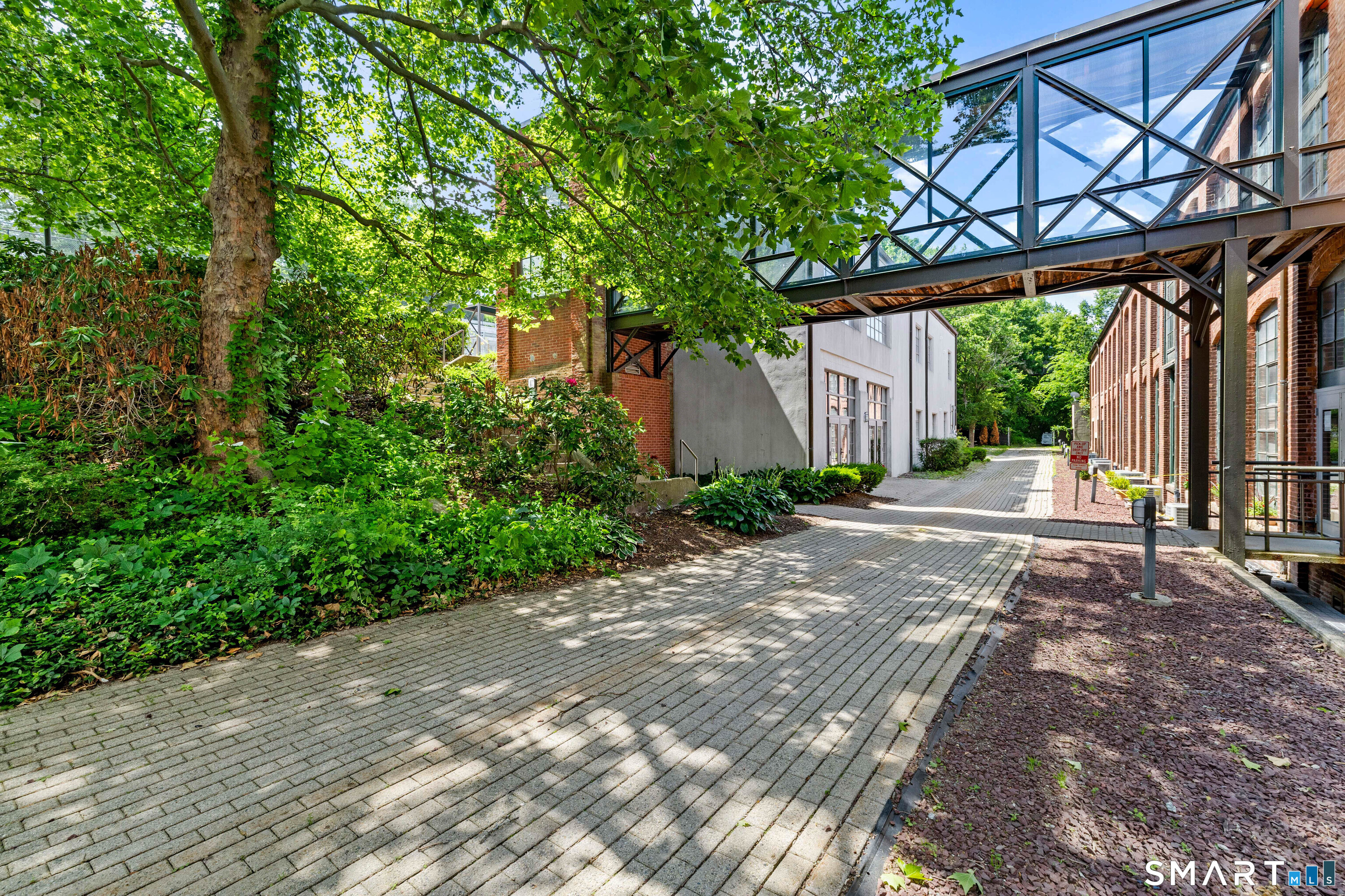 68 Thermos Avenue, Unit 110A Norwich, CT 06360 - Photo 38 of 39 a view of a patio with a yard