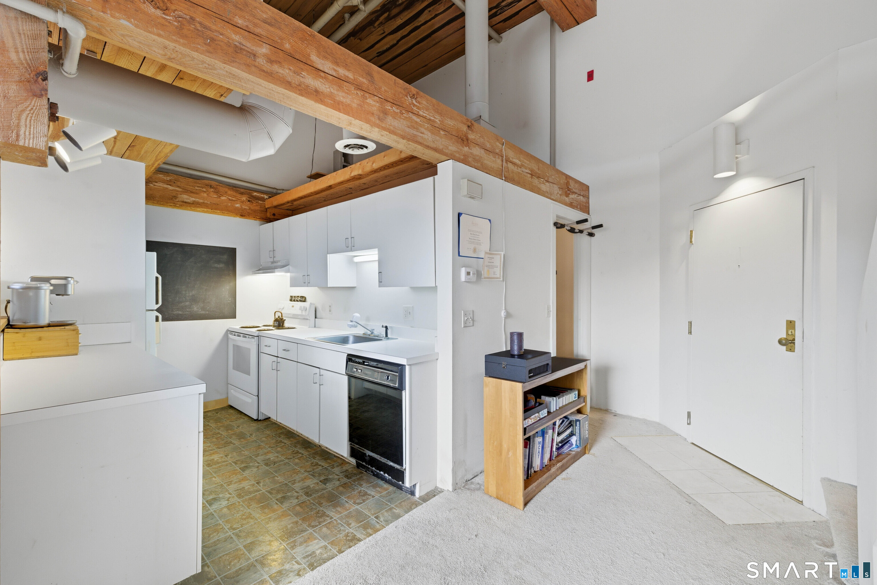 68 Thermos Avenue, Unit 110A Norwich, CT 06360 - Photo 10 of 39 a kitchen with a stove a refrigerator and a cabinets
