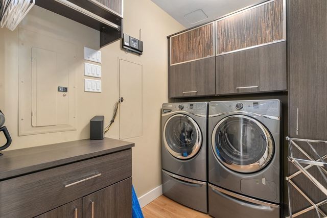 a view of storage and utility room with washer and dryer