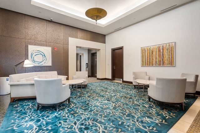 a living room with a couch and a table