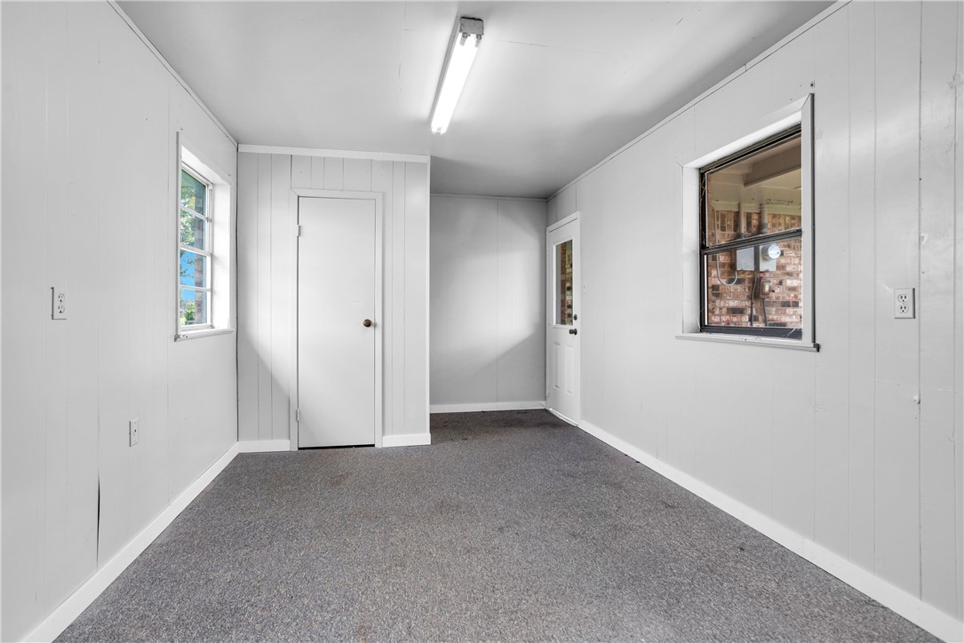 21356 Highway 90 Sabinal, TX 78881 - Photo 27 of 44 Spare room featuring carpet flooring and baseboards