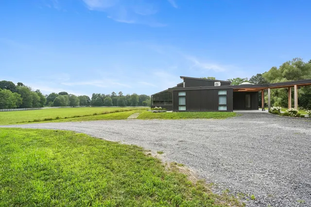 a view of a house with a big yard