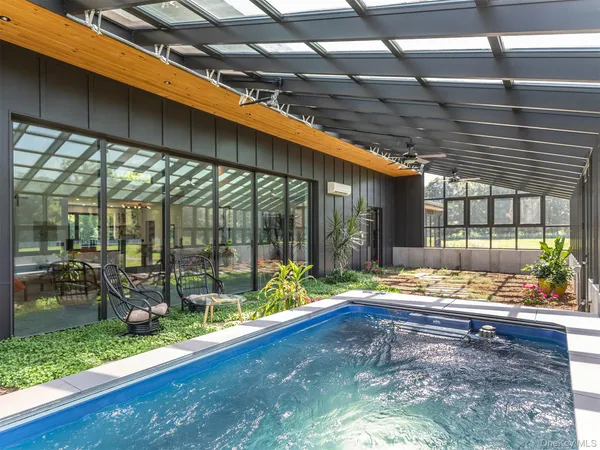 a building outdoor space with patio furniture and wooden floor
