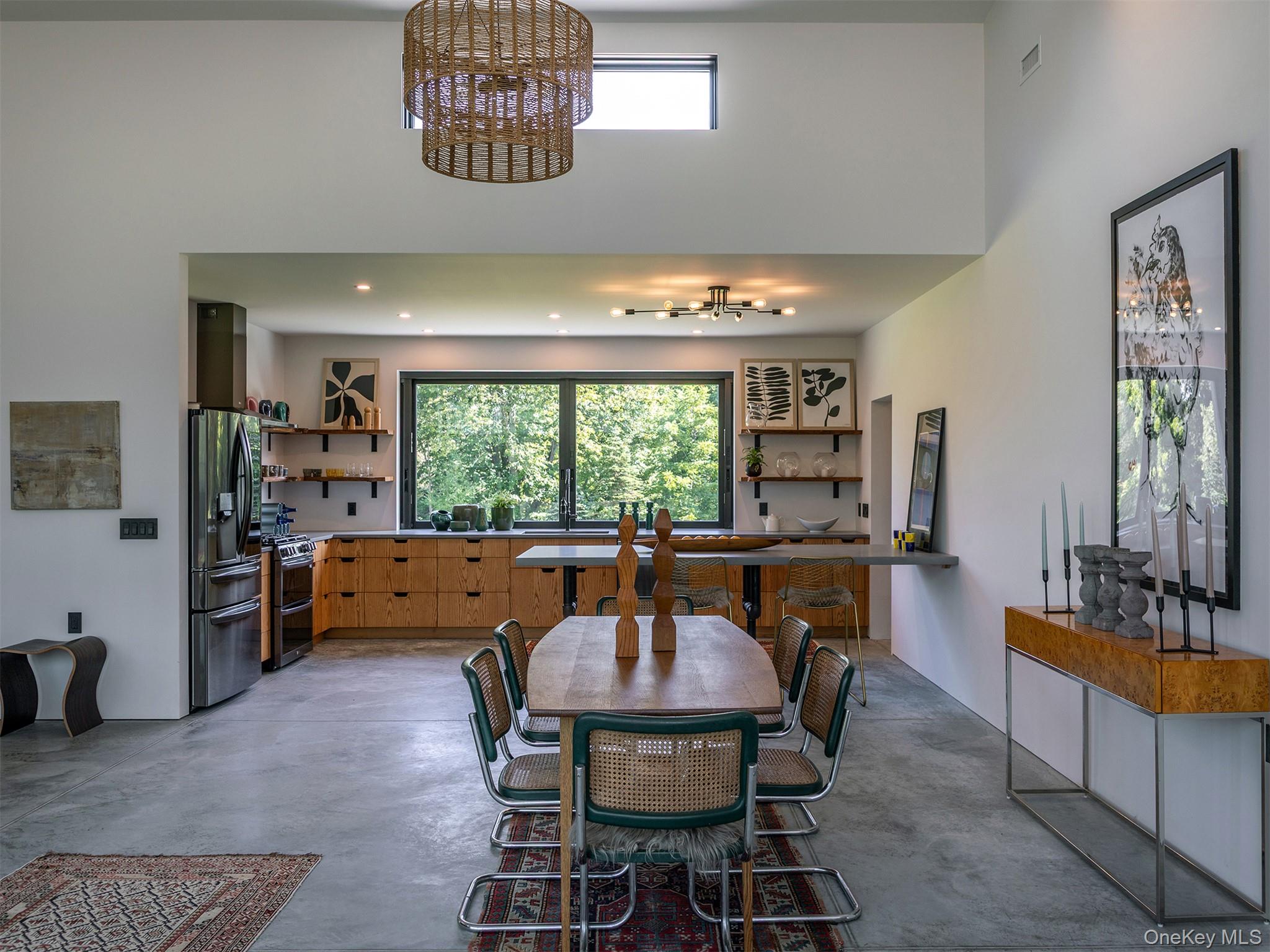 476 Carpenter Hill Road Pine Plains, NY 12567 - Photo 21 of 50 Dining area featuring a high ceiling and finished concrete floors