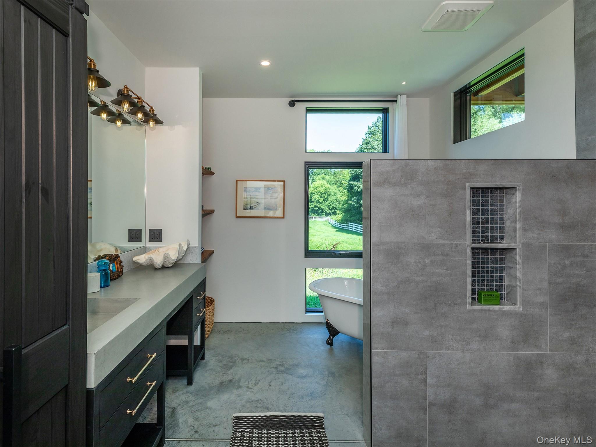 476 Carpenter Hill Road Pine Plains, NY 12567 - Photo 28 of 50 Full bathroom with finished concrete flooring, vanity, a soaking tub, and recessed lighting
