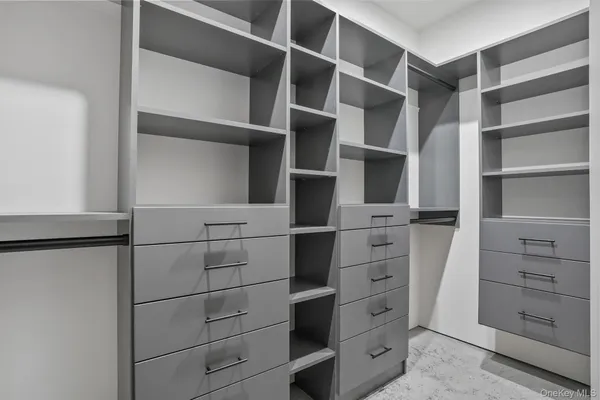 a view of an empty walk in closet