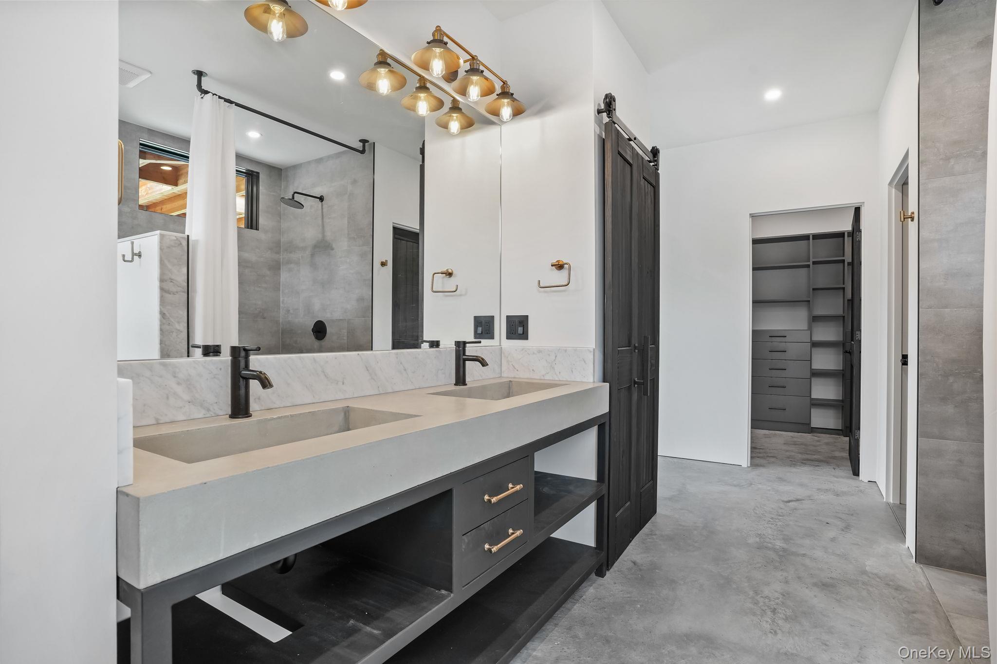 476 Carpenter Hill Road Pine Plains, NY 12567 - Photo 36 of 50 En suite Full bathroom with a tile shower, concrete floors, double vanity, a walk in closet, and recessed lighting