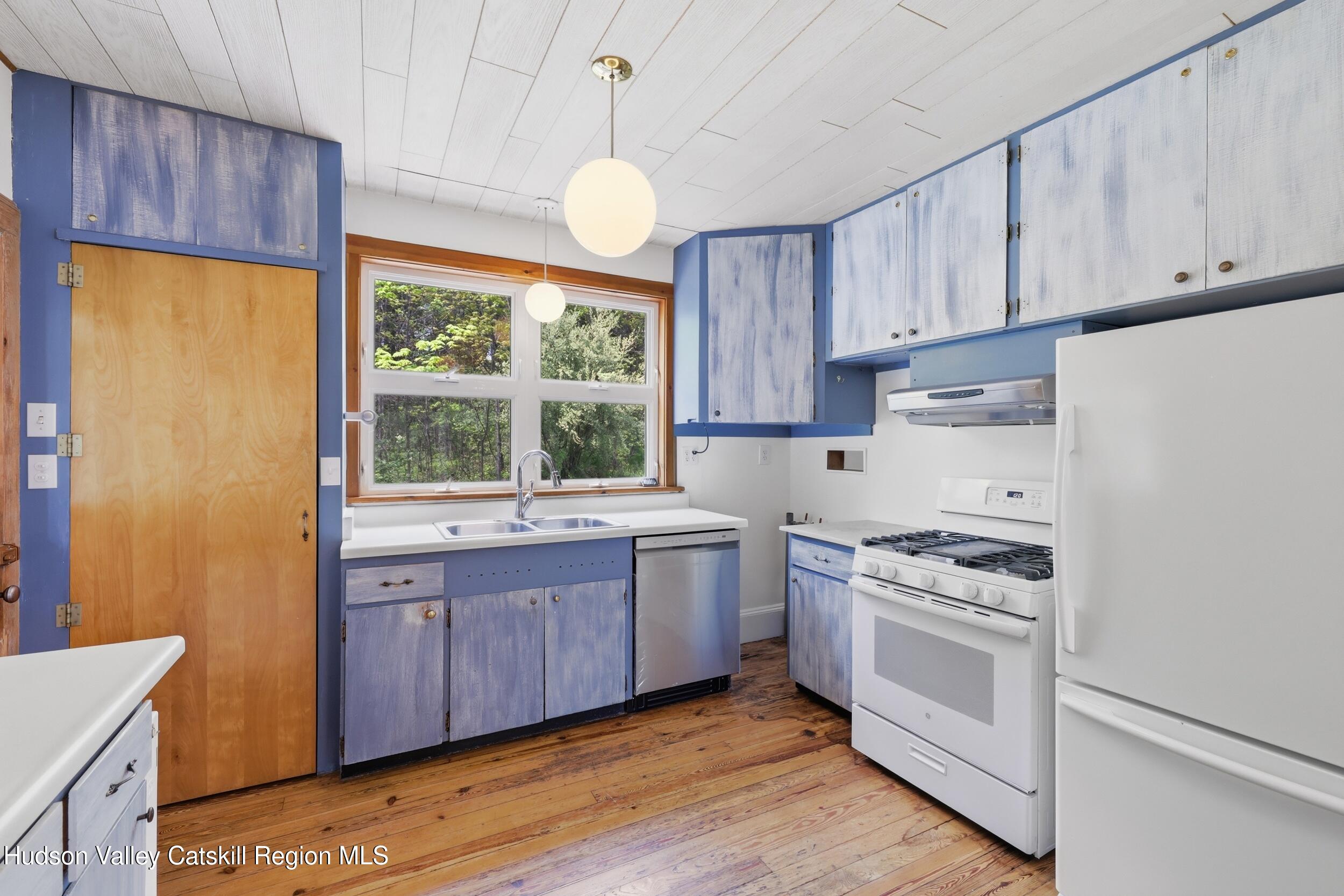 294 Kyserike Road Accord, NY 12404 - Photo 13 of 46 a kitchen with a stove a sink and a window
