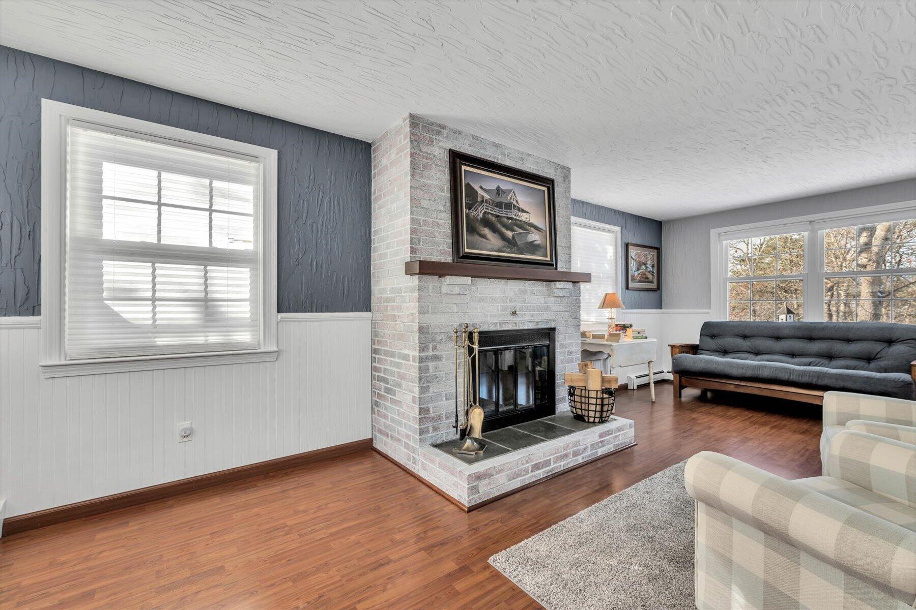 3 McNamara Road West Yarmouth, MA 02673 - Photo 13 of 45 a living room with furniture and a fireplace