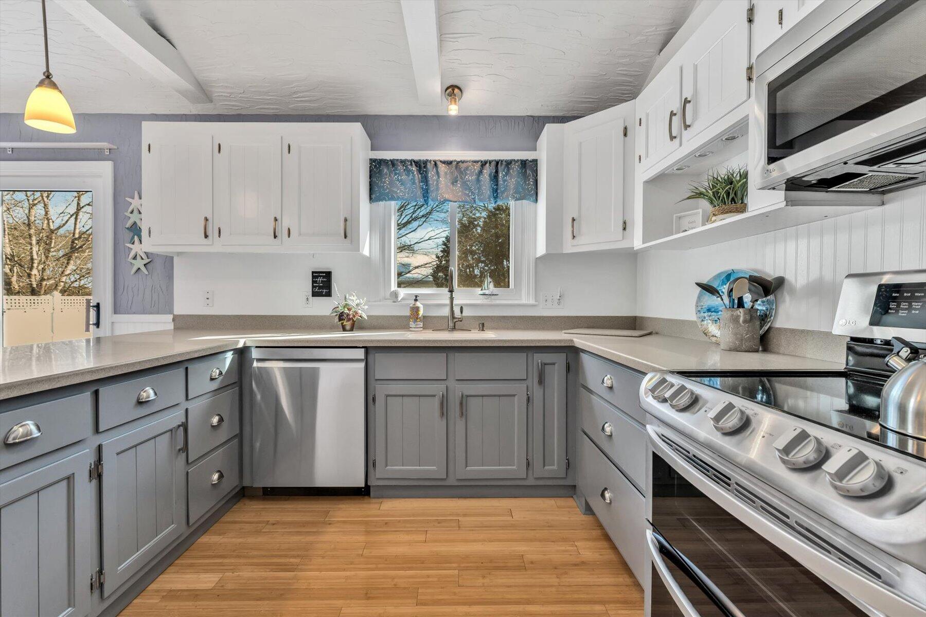 3 McNamara Road West Yarmouth, MA 02673 - Photo 19 of 45 a kitchen with stainless steel appliances a sink stove and cabinets