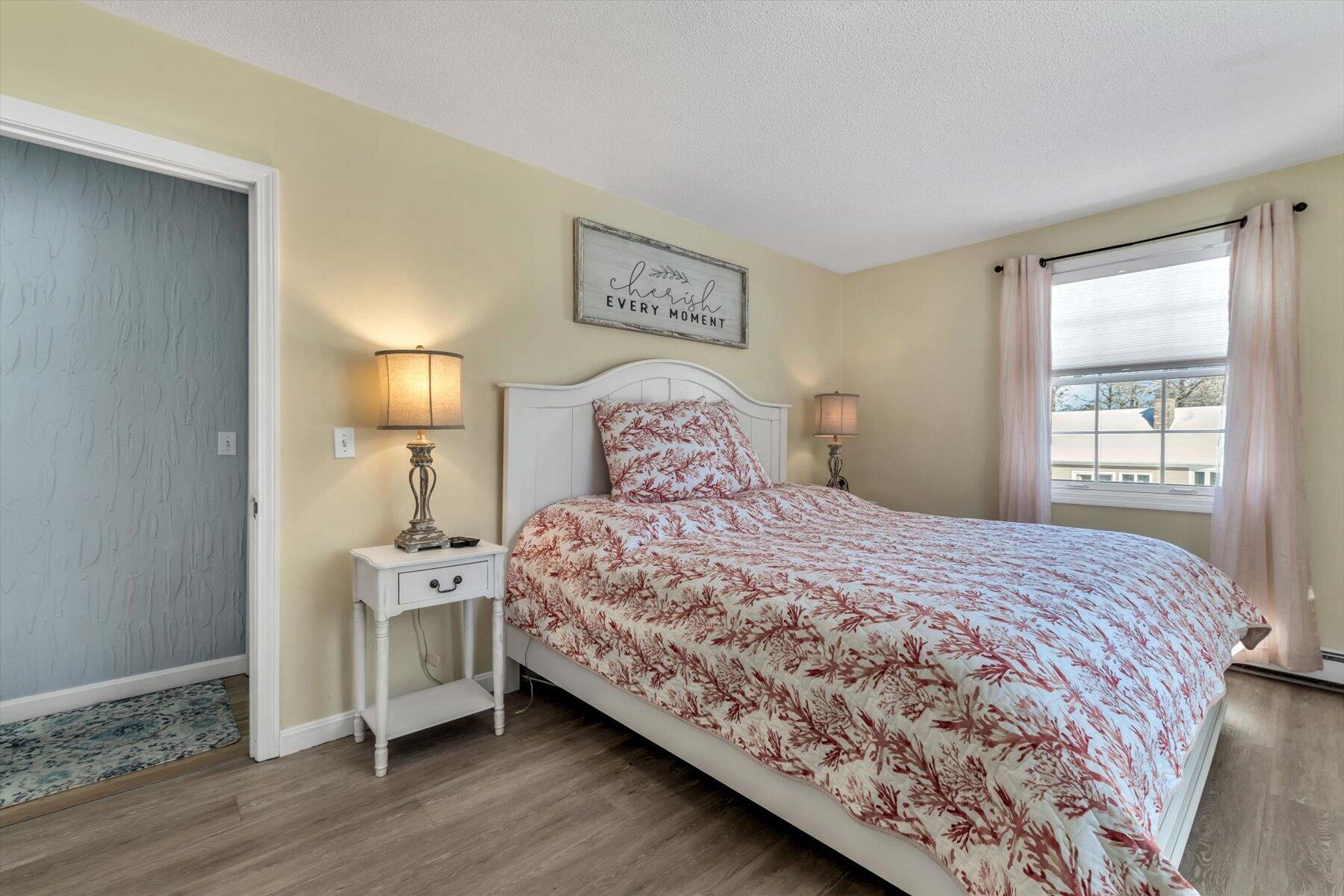 3 McNamara Road West Yarmouth, MA 02673 - Photo 26 of 45 a bedroom with a bed and a lamp