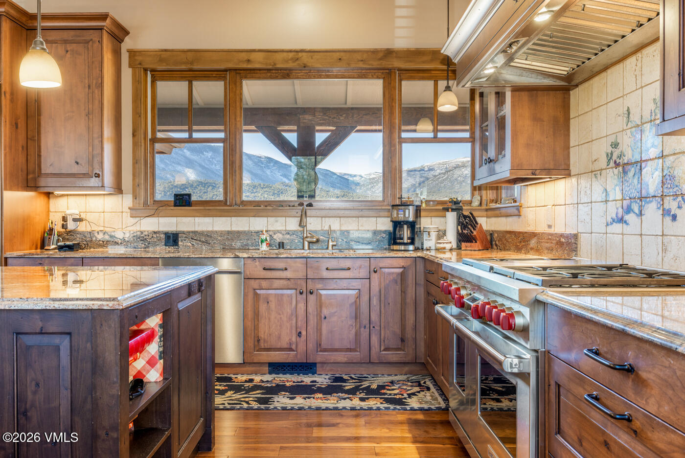 34900 Colorado River Road McCoy, CO 80463 - Photo 15 of 46 a kitchen with stainless steel appliances granite countertop a stove a sink and a microwave