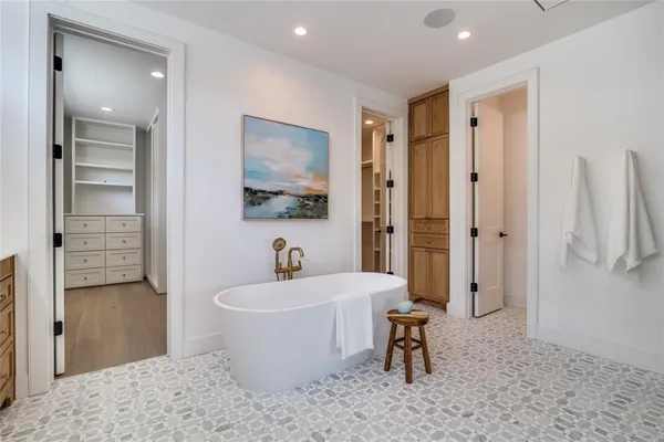 a bathroom with a sink a bathtub and shower