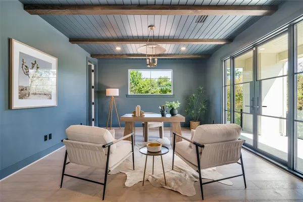 a dining room with furniture and window