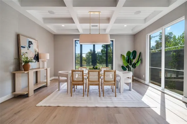 a living room with furniture a window and a table