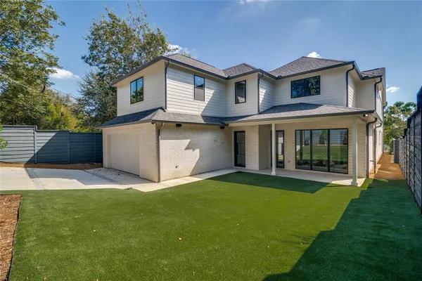 a view of an house with backyard space and garden