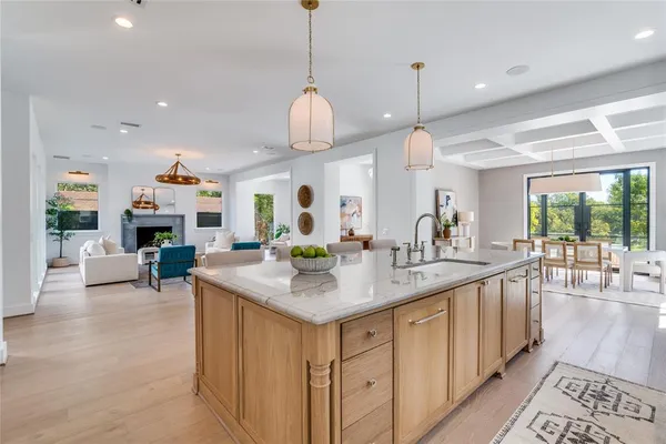 a view of living room and kitchen with a sink
