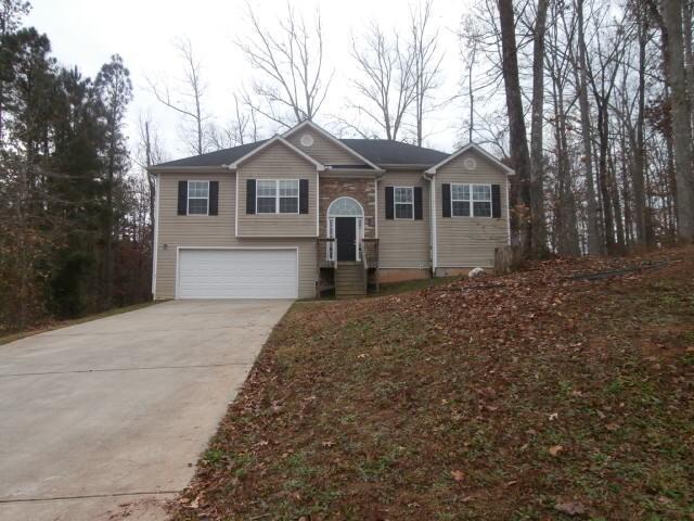 45 Ritas Court Covington, GA 30016 - Photo 1 of 1 a front view of a house with a yard and garage