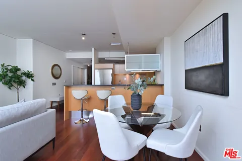 a kitchen with stainless steel appliances granite countertop a sink and a microwave